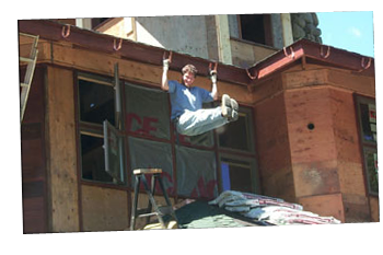 Dave Snyder Hanging Off Of Copper Gutter Hangers